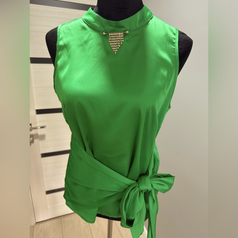 Green silk blouse with crystal pin